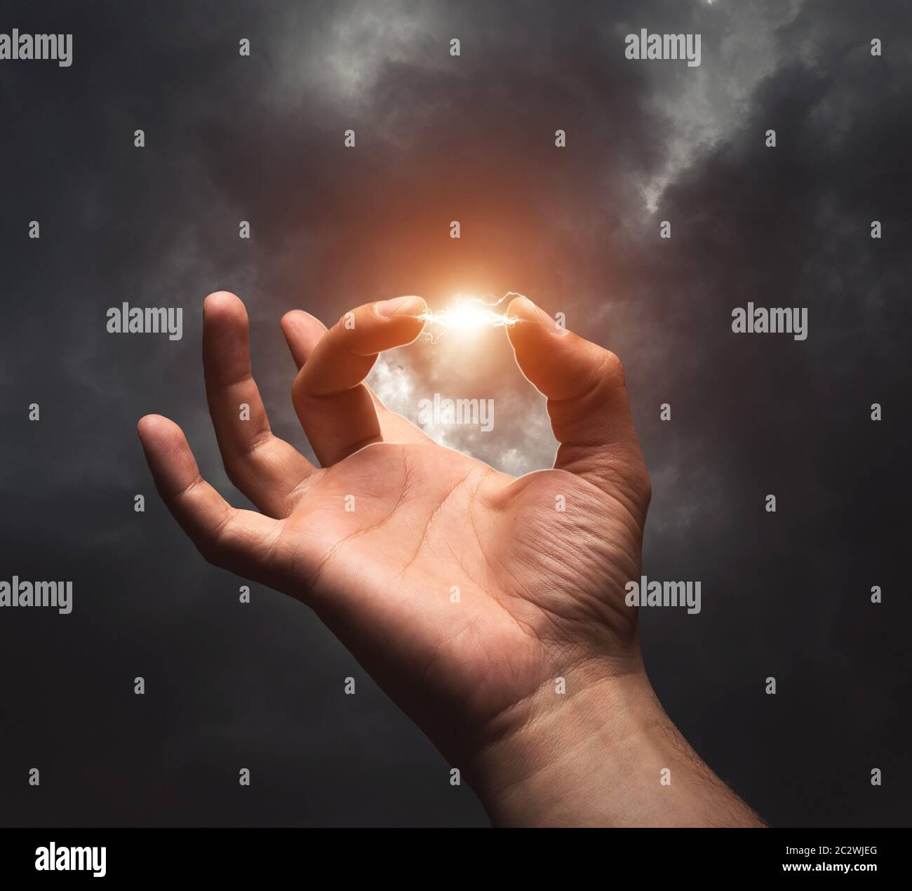 Lightning between two fingers against dark background Stock Photo Alamy