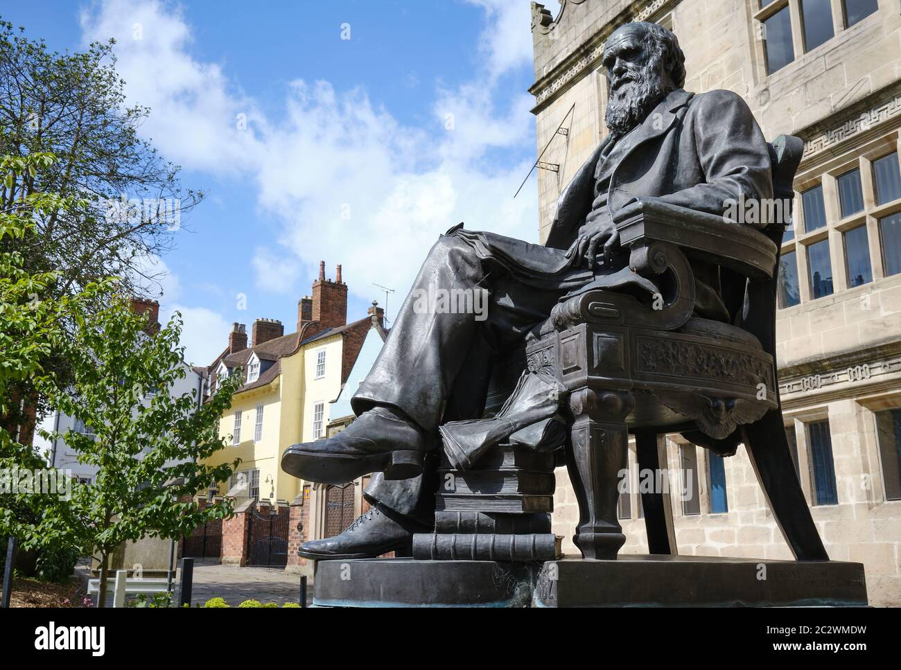 statue of Charles Darwin outside the old Shrewsbury School where he was educated Stock Photo