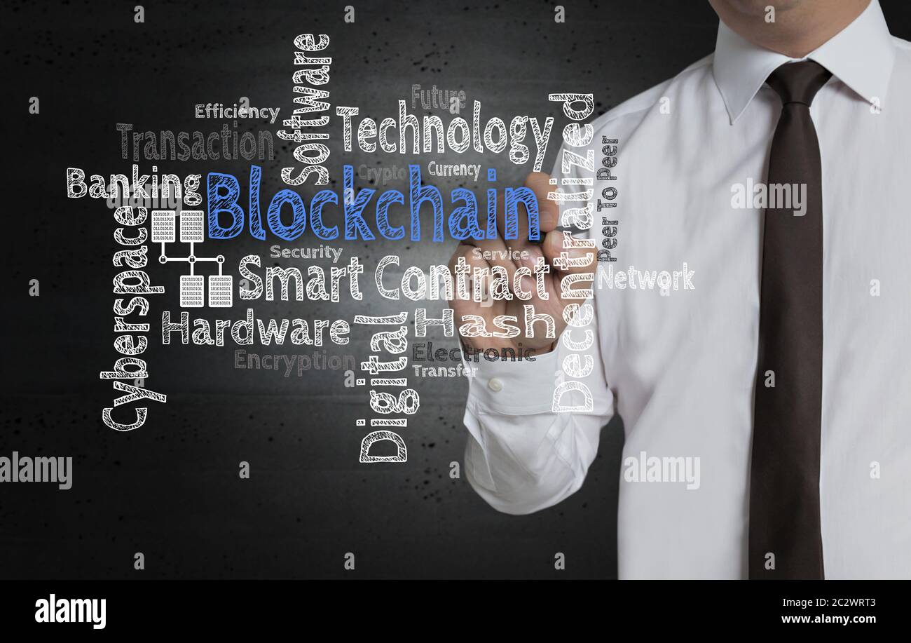 Blockchain Cloud is written by businessman on screen. Stock Photo