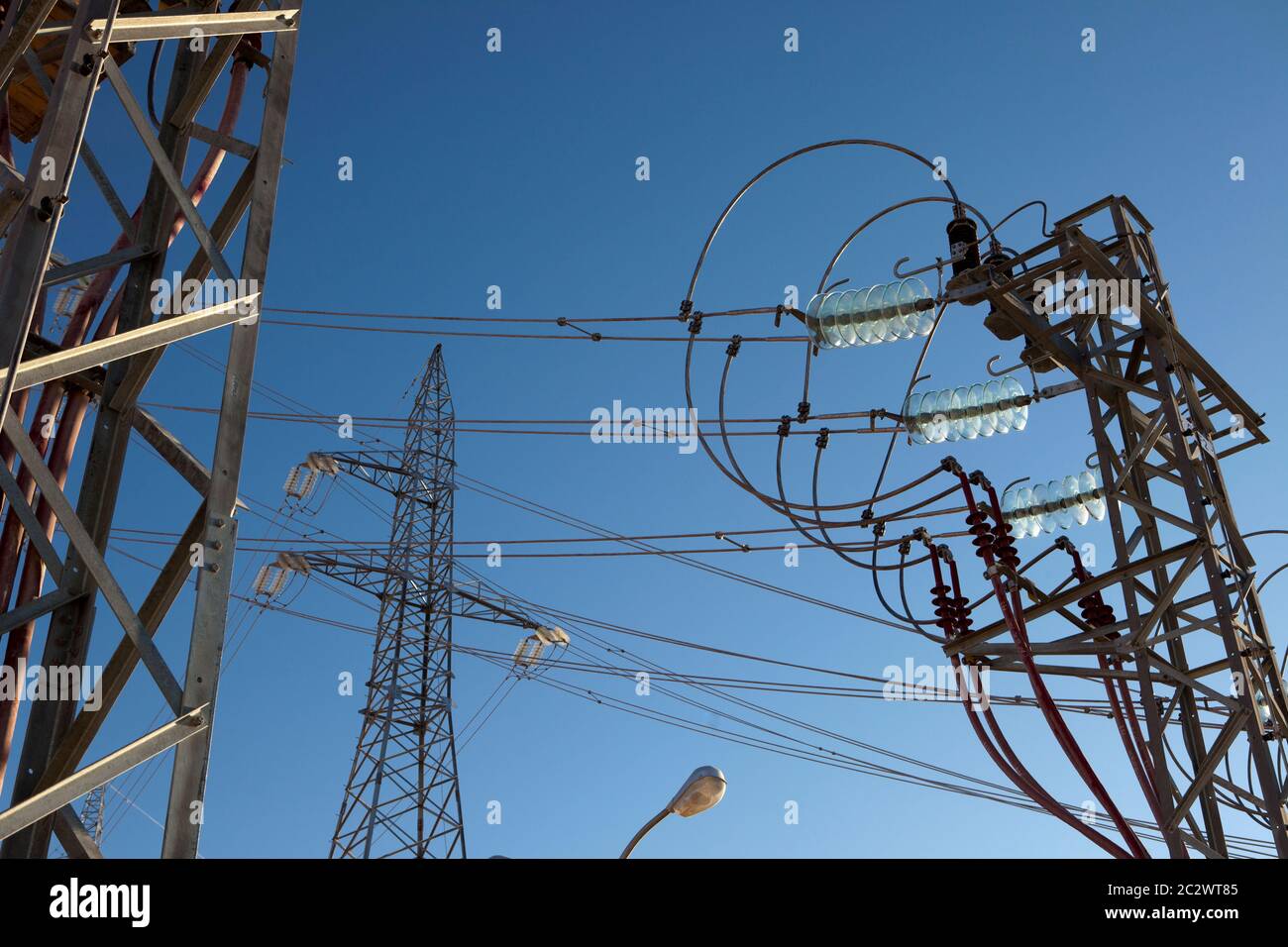 High voltage cable connectors at a sub-station carrying power to a new oil facility in the Sahara desert. Stock Photo