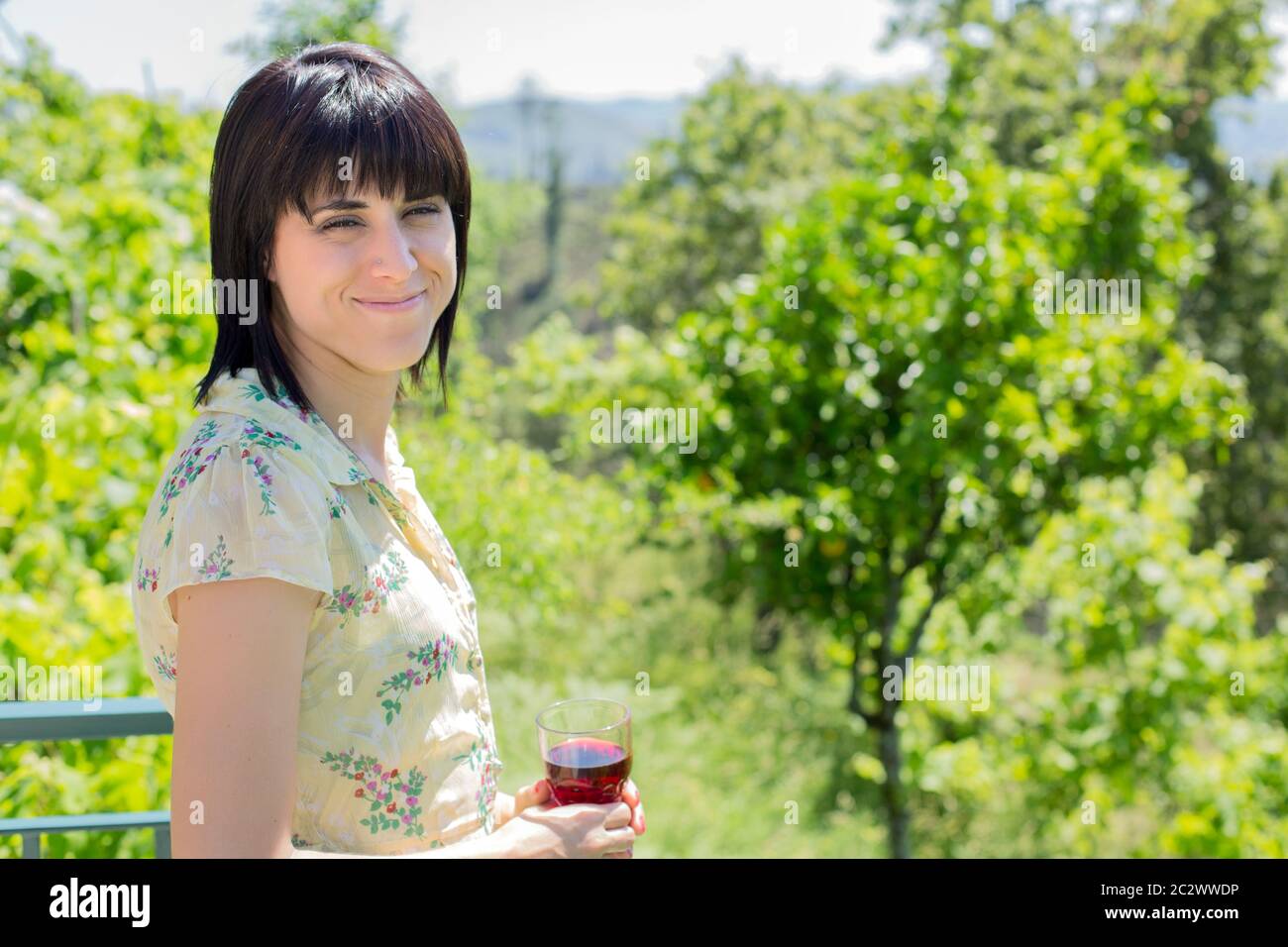 woman drinking red wine in a vineyard, outdoor Stock Photo - Alamy