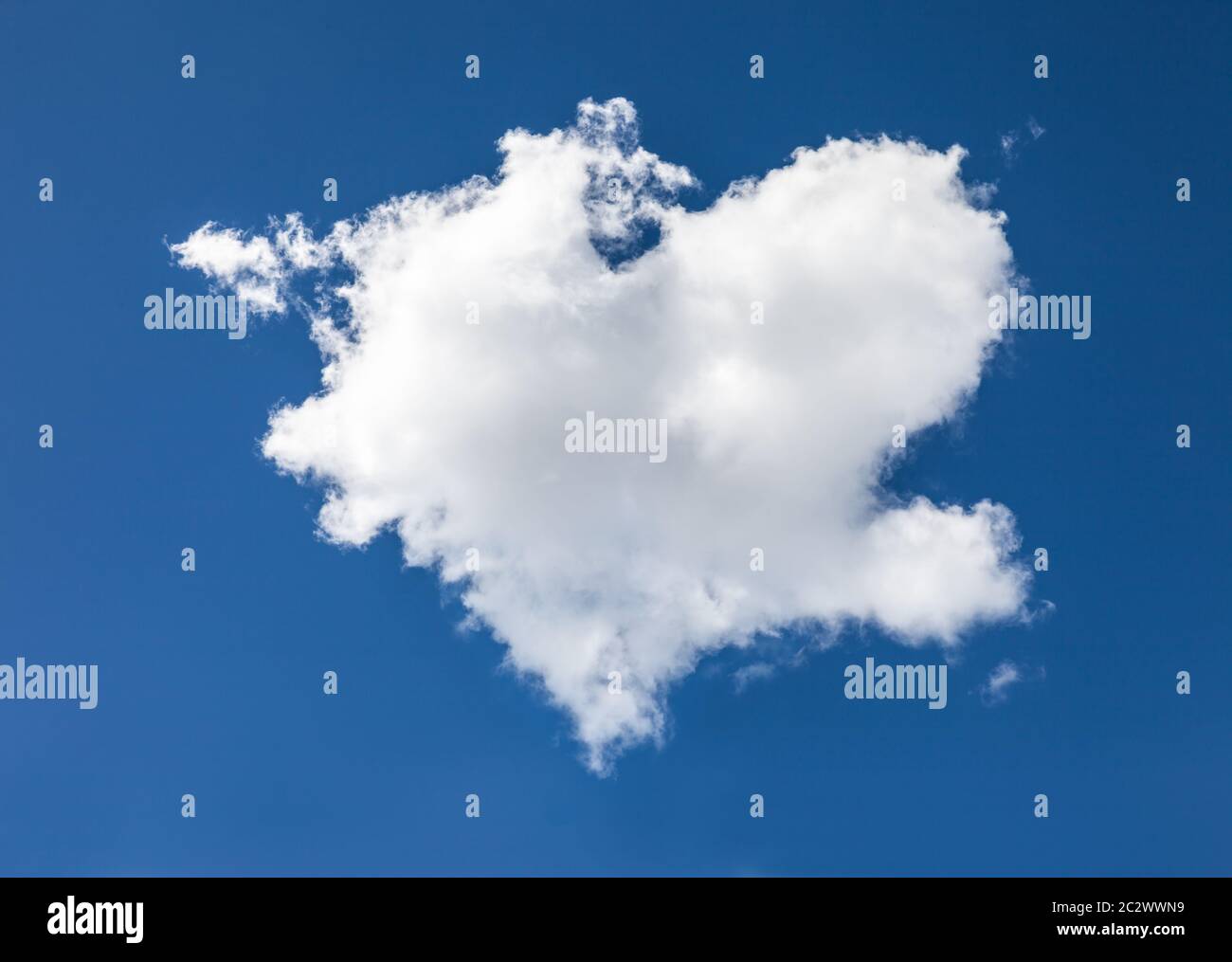 Cloud in heart shape in front of blue sky Stock Photo - Alamy