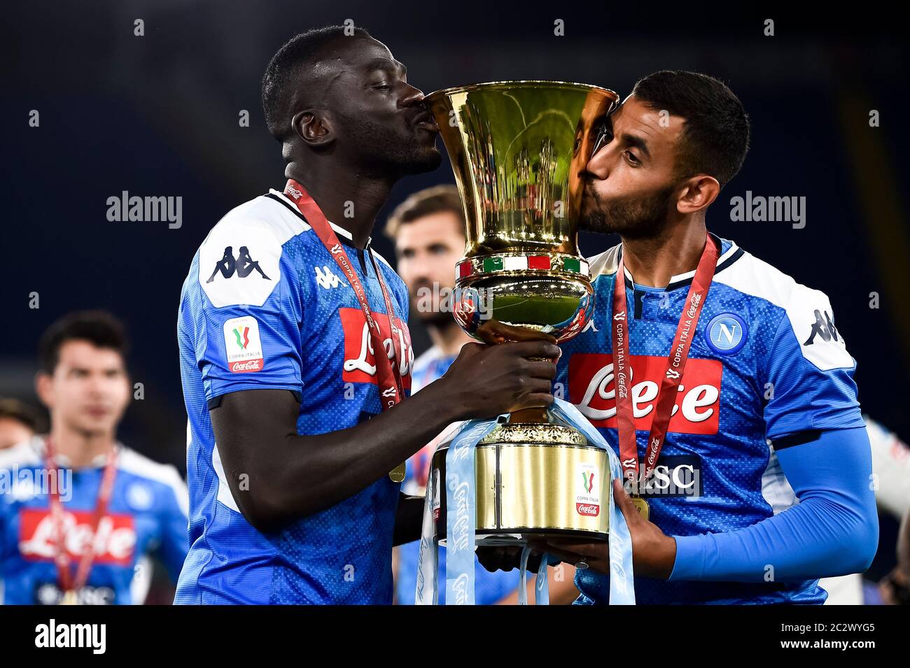 Rome, Italy - 17 June, 2020: Kalidou Koulibaly (L) and Faouzi Ghoulam of SSC Napoli kiss the trophy during the awards ceremony at end of the Coppa Italia final football match between SSC Napoli and Juventus FC. SSC Napoli won 4-2 over Juventus FC after penalty kicks, regular time ended 0-0. Credit: Nicolò Campo/Alamy Live News Stock Photo