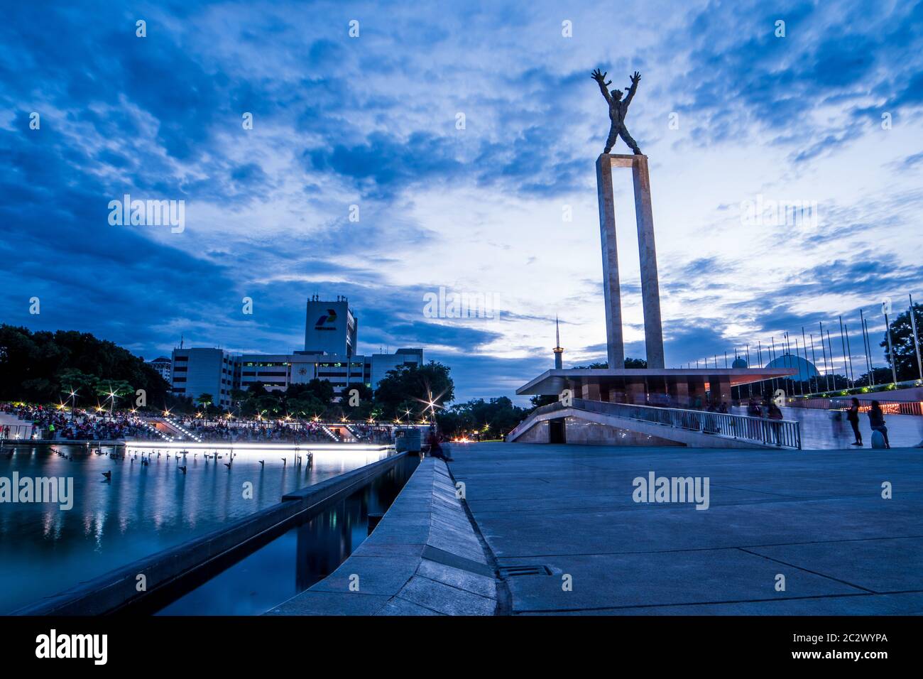 The Beauty of Statue of Irian Jaya Liberation Monument, Jakarta with cloudy sky in the evening Stock Photo
