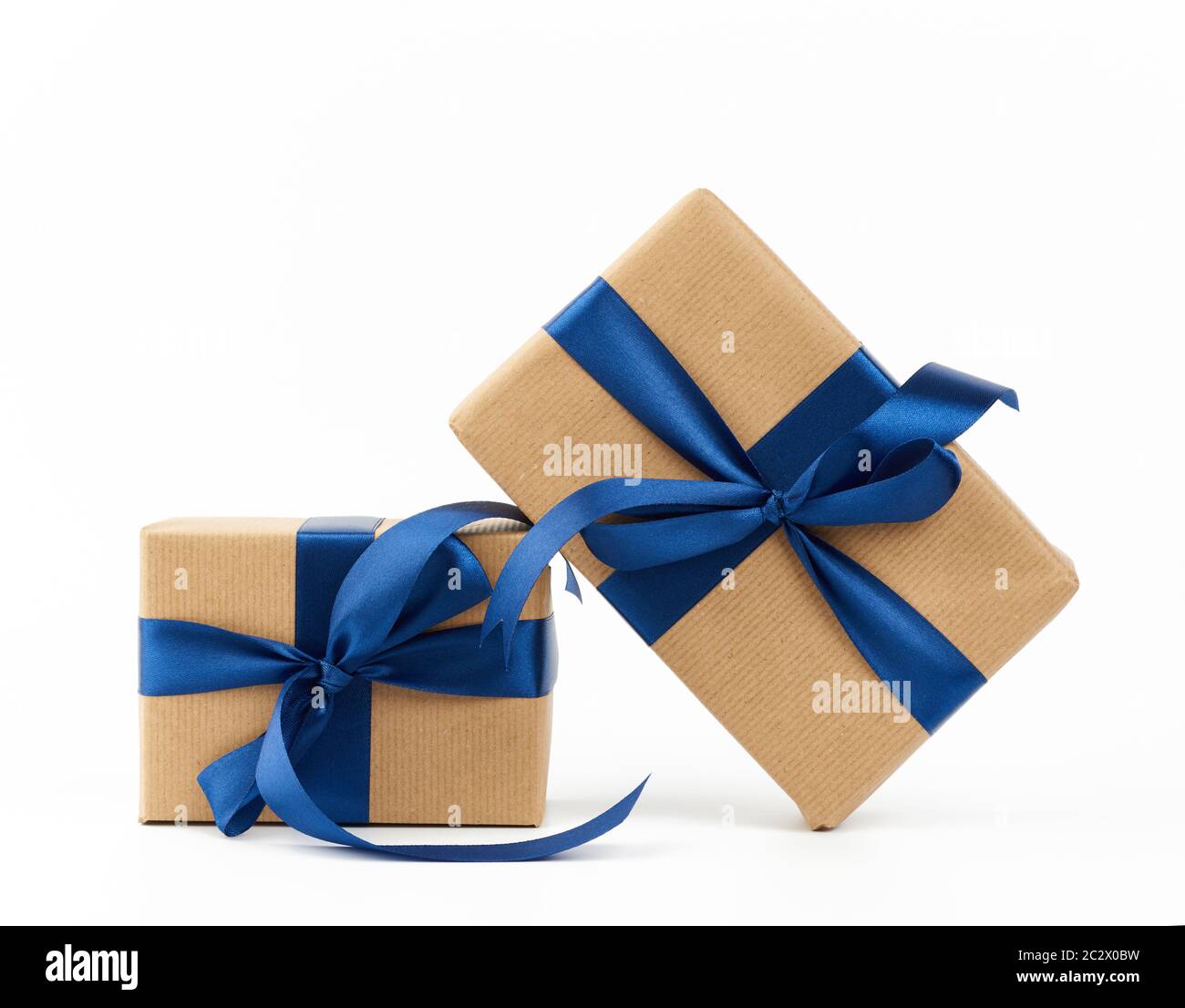 rectangle box wrapped in brown kraft paper and tied with a silk blue ...