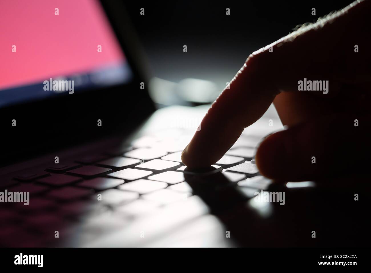 Close-up Of A Person's Hand Typing On Laptop Stock Photo