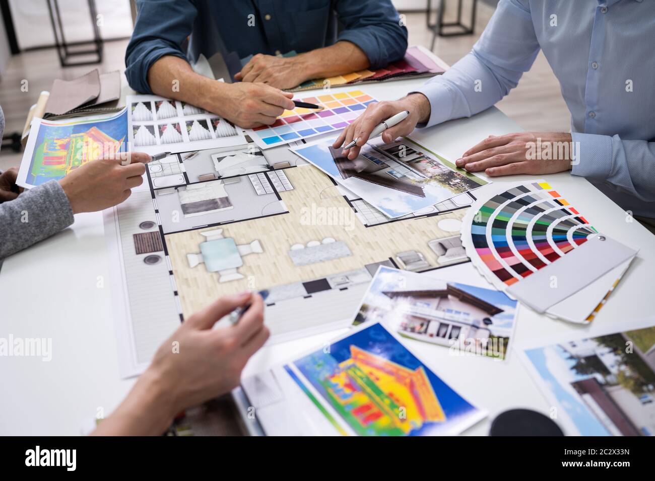 Architects And Designers Working On Color Selection For House Stock Photo