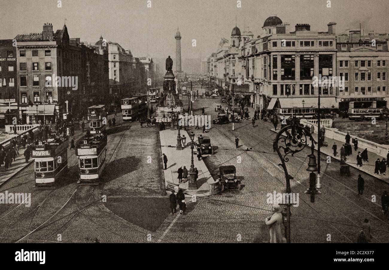 An early 1920's view of the O'Connell Bridge over the River Liffey, in Dublin City, Ireland. Nelson's column in the background was later blown up by the IRA in 1966. Originally photographed by Clifton Adams (1890-1934) for "Ireland: The Rock Whence I Was Hewn", a National Geographic Magazine feature from March 1927. Stock Photo