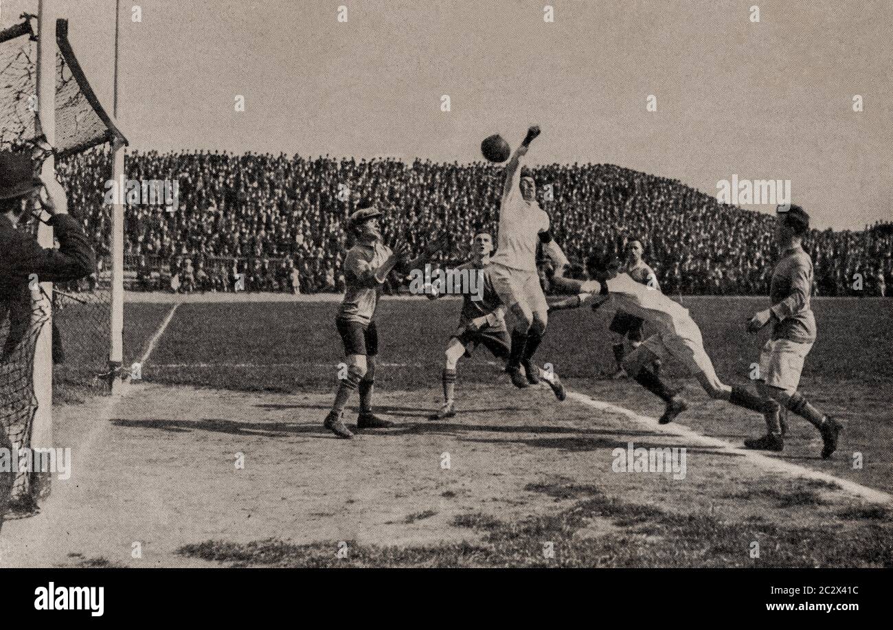 An early 1920's photograph of the G.A.A. game of Gaelic Football match played at Croke Park, Dublin City, Ireland. Originally photographed by Clifton Adams (1890-1934) for 'Ireland: The Rock Whence I Was Hewn', a National Geographic Magazine feature from March 1927. Stock Photo