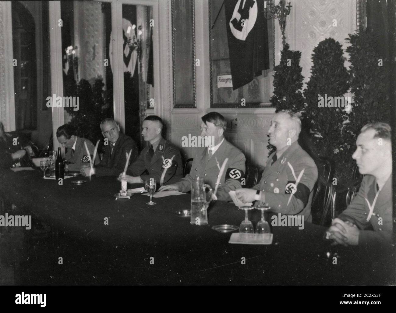 Conference - Goebbels, Frick, Gauleiter Wagner, Baden; Hitler, Ley, Bormann, Marti Heinrich Hoffmann Photographs 1933 Adolf Hitler's official photographer, and a Nazi politician and publisher, who was a member of Hitler's intimate circle. Stock Photo