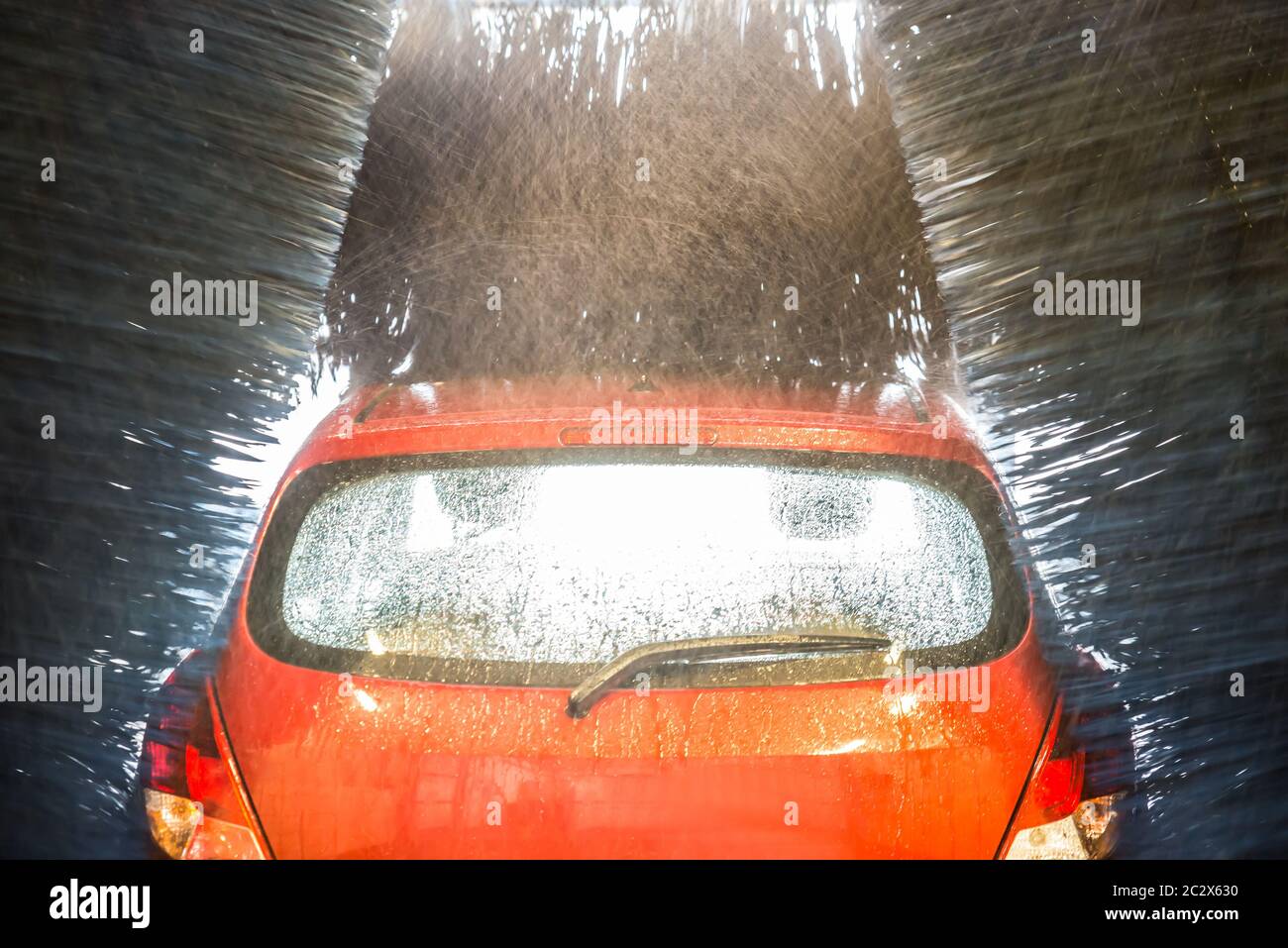 Automatic Car Wash With Water In Action Stock Photo Alamy