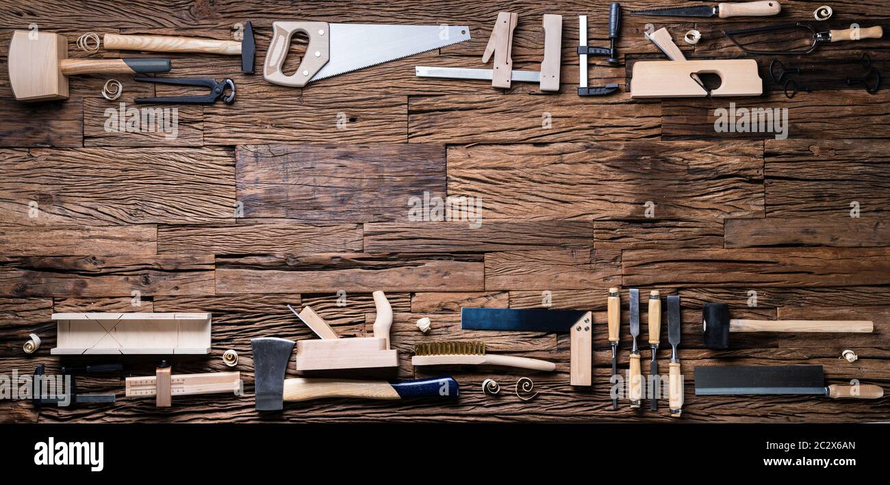 Various Carpenter Tools From Toolkit Laying On Desk Stock Photo