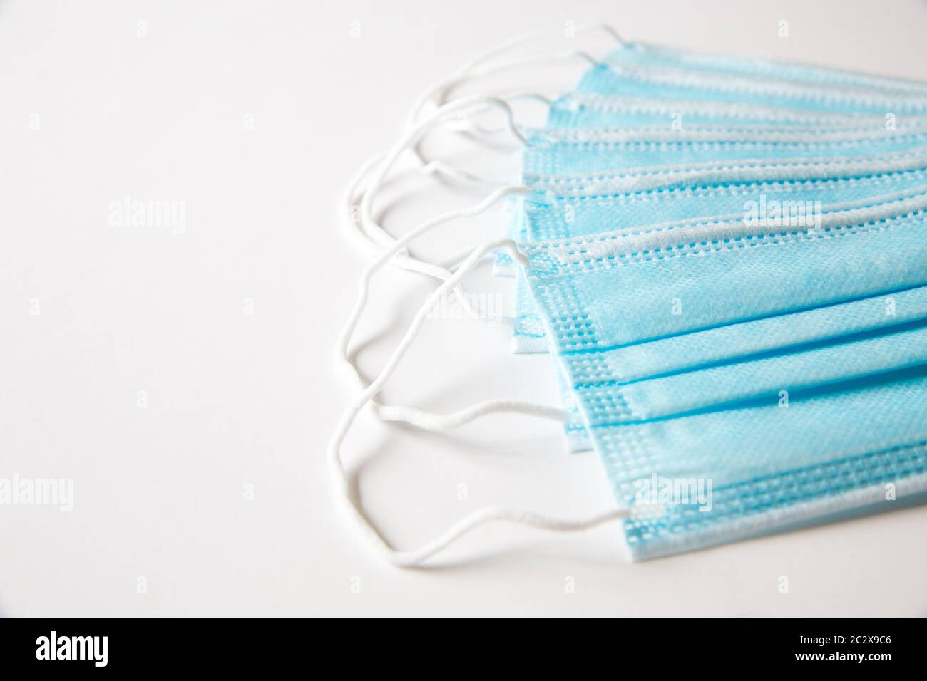 An example of blue surgical face mask used to protect the public from infectious diseases such as Coronavirus. Stock Photo