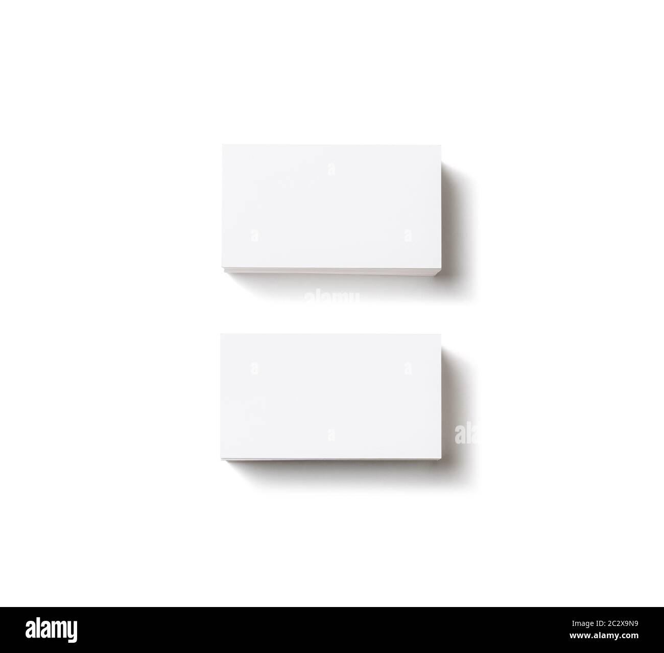 Photo of blank business cards with soft shadows on white background ...