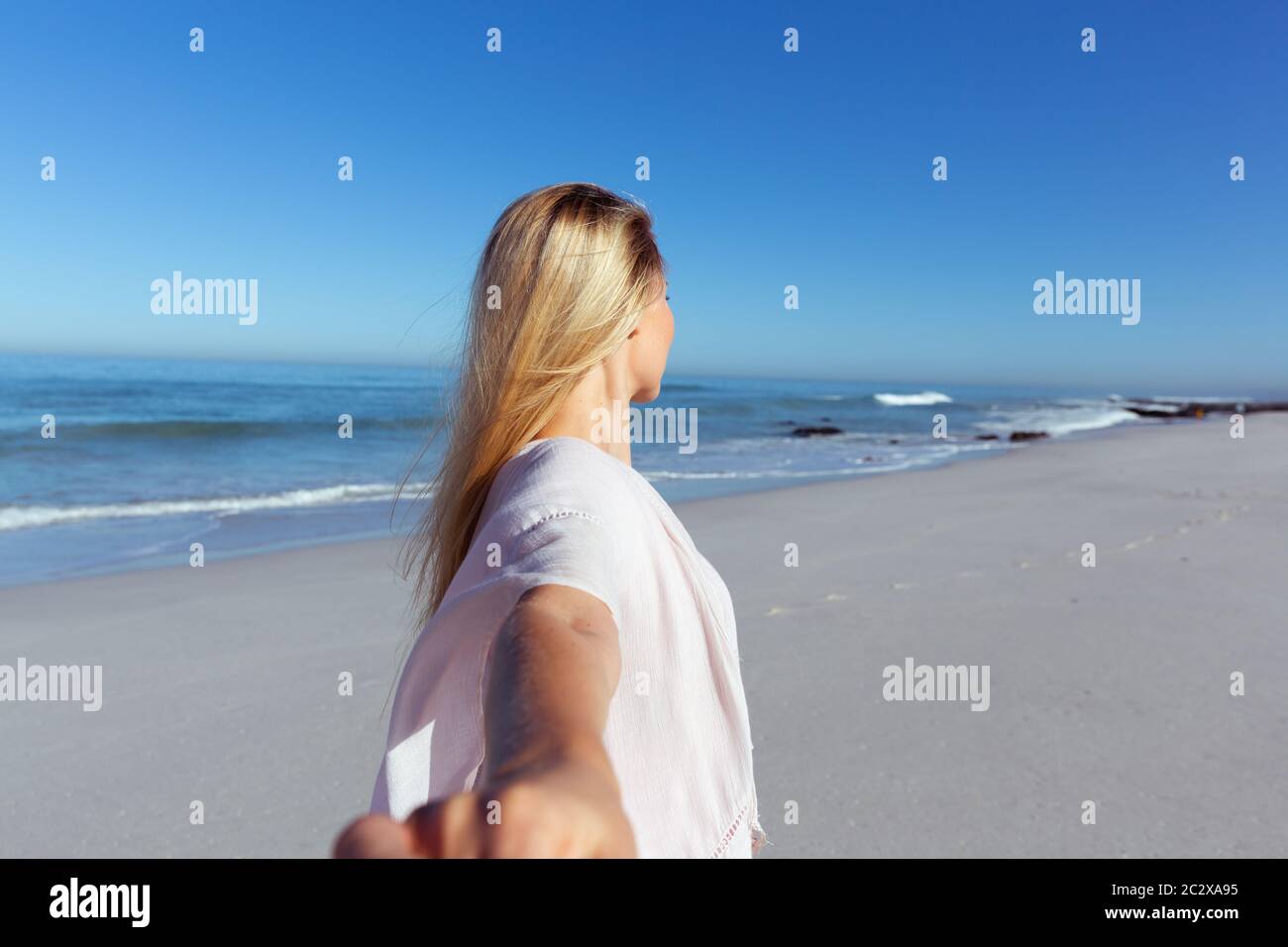 Woman enjoying the beach hi-res stock photography and images - Alamy