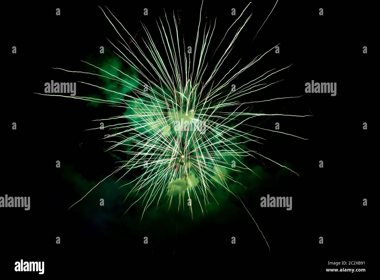 Two Green Sparkling Fireworks Background on Night Scene. Abstract color fireworks background and smoke on sky Stock Photo