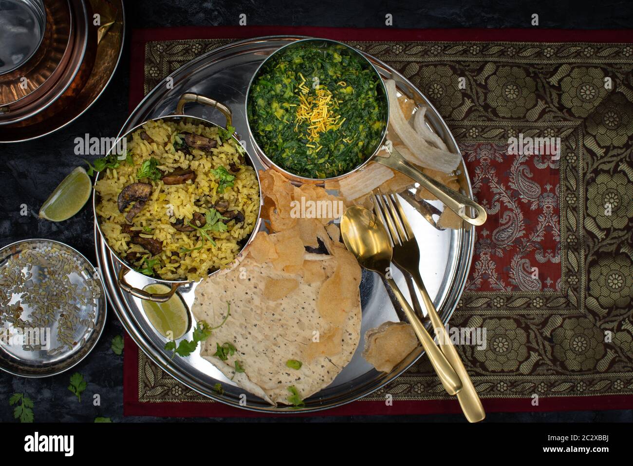 Vegan North Indian mushroom pilaf and spinach served in traditional