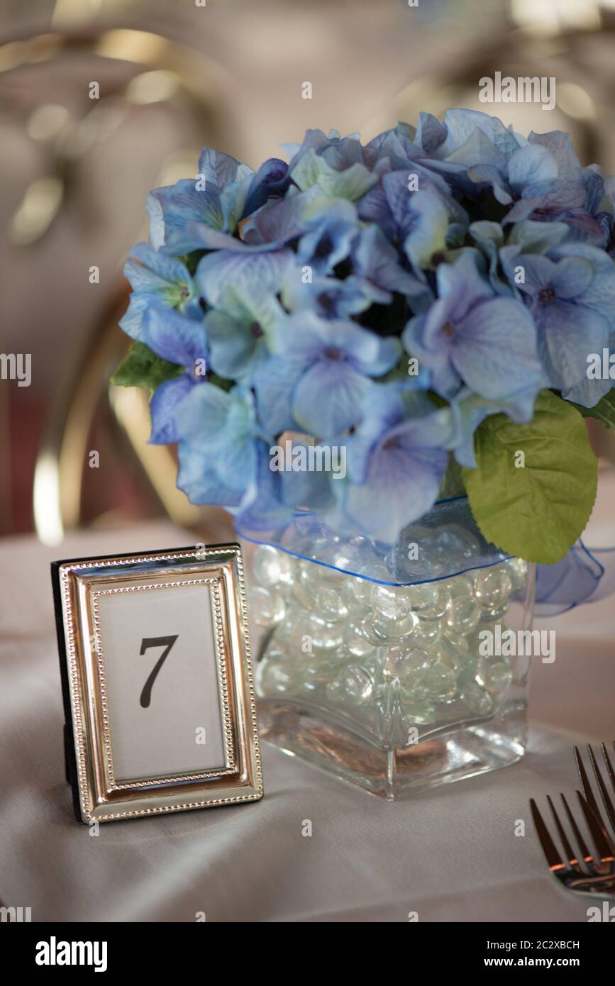 The number 7 on a table with flowers Stock Photo