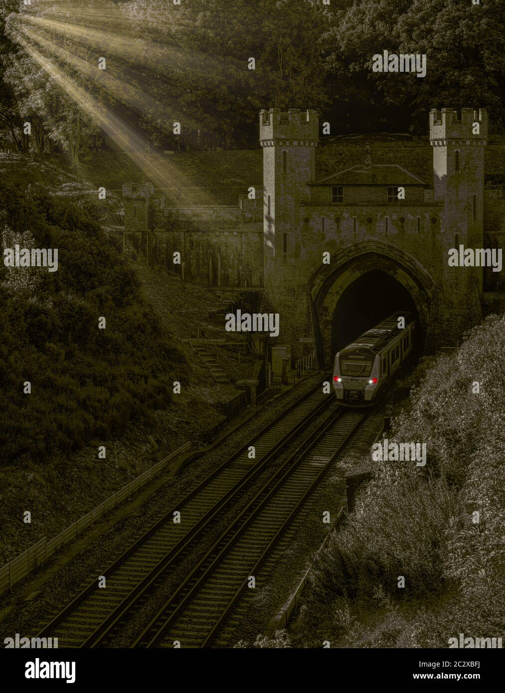 train exiting a tunnel with sunlight Stock Photo