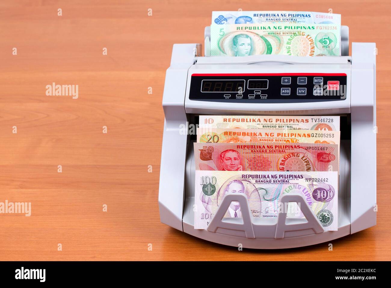 Old money from the Philippines in a counting machine Stock Photo Alamy
