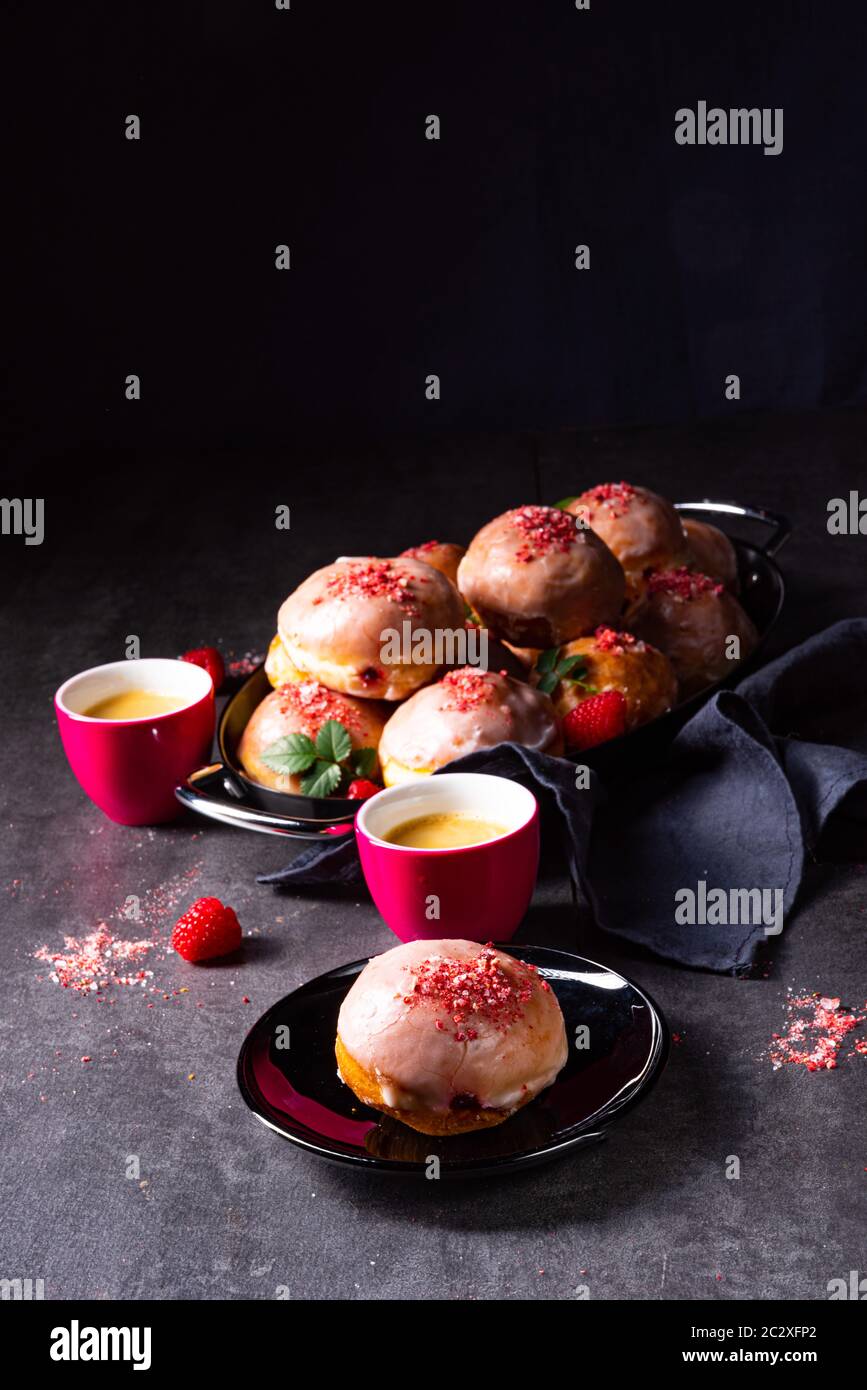 Delicious Berlin donuts filled with raspberry jam Stock Photo - Alamy
