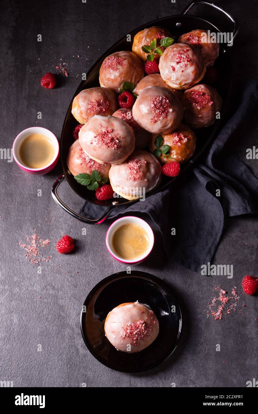 Delicious Berlin donuts filled with raspberry jam Stock Photo - Alamy