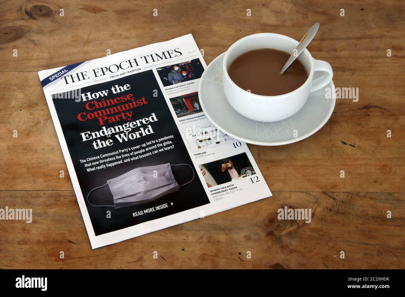 EPOCH Times magazine May 2020, How the Chinese Communist Party Endangered the World with a cup of tea in white teacup Stock Photo