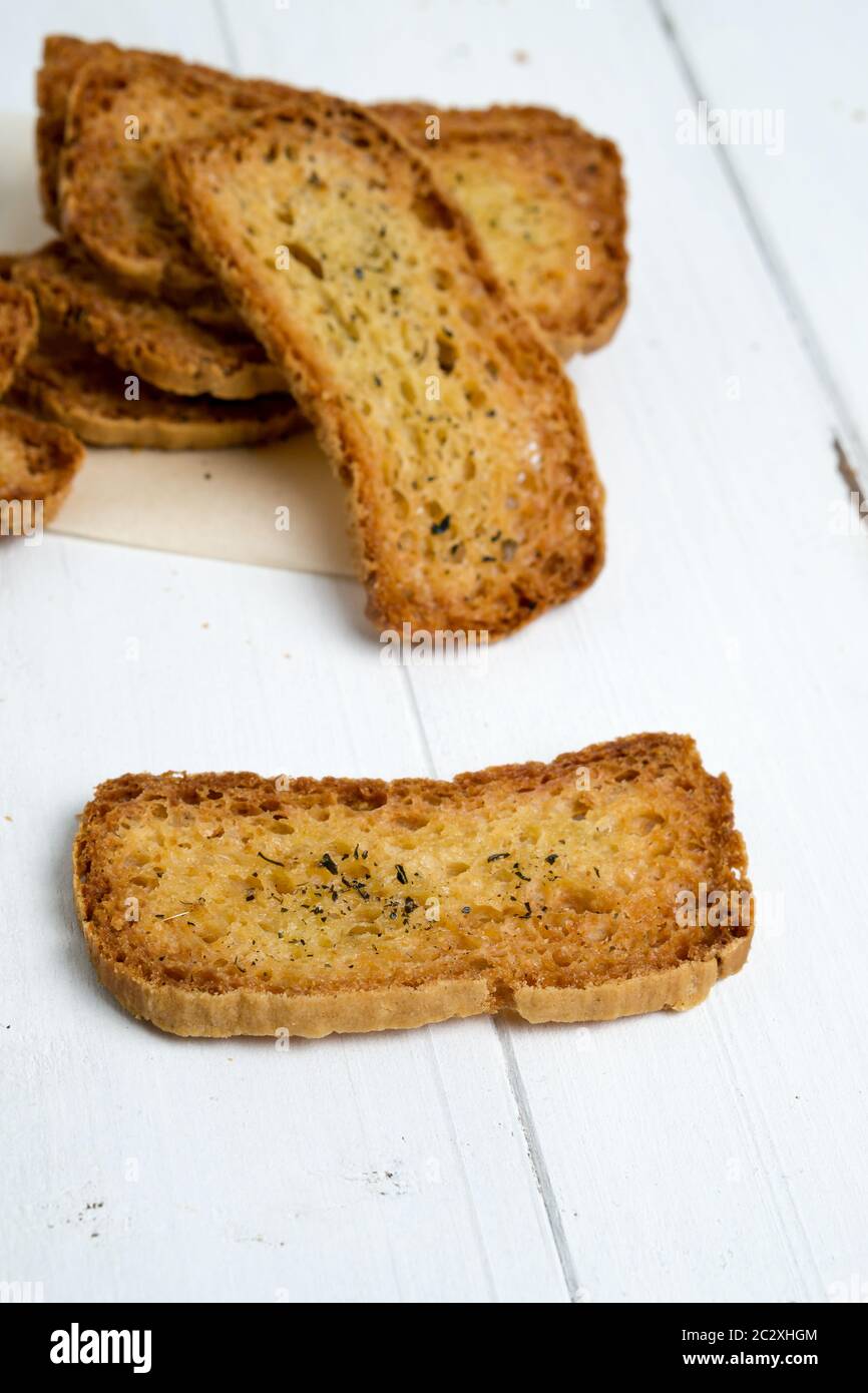 Crostini without toppings on a white background. A crostino is a small