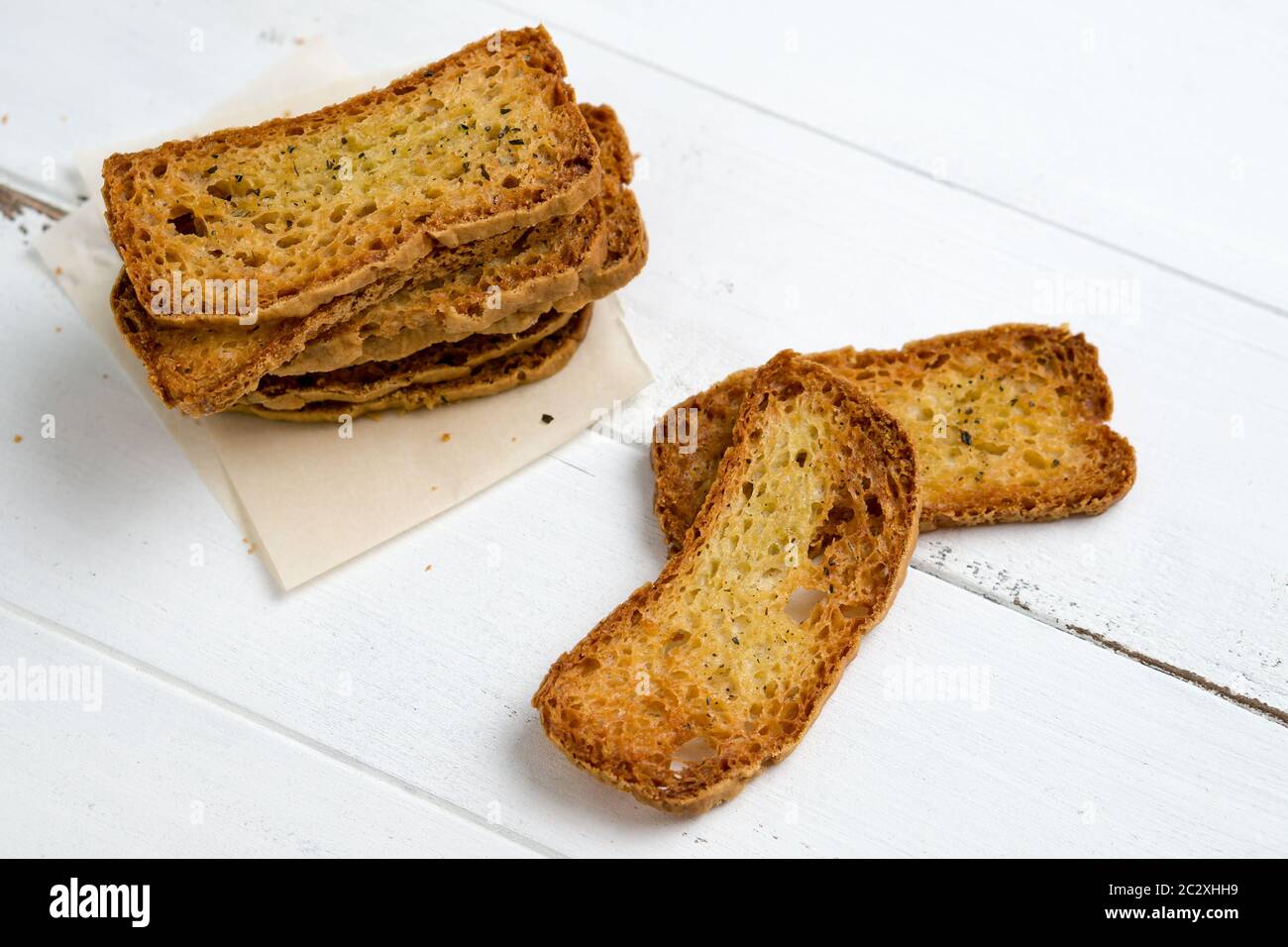 Crostini without toppings on a white background. A crostino is a small ...