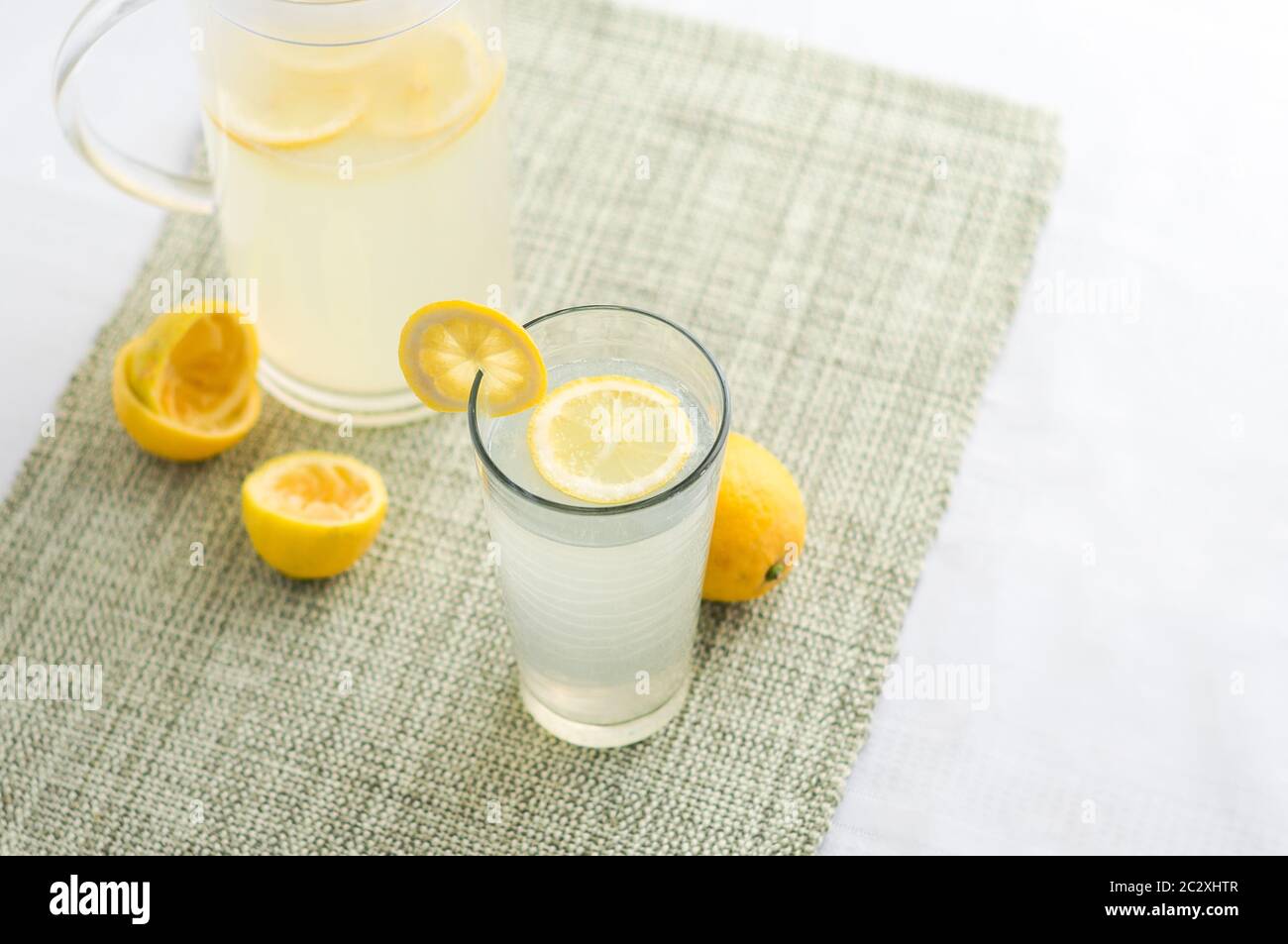 Freshly squeezed lemonade juice glass. Lemonade is traditionally a