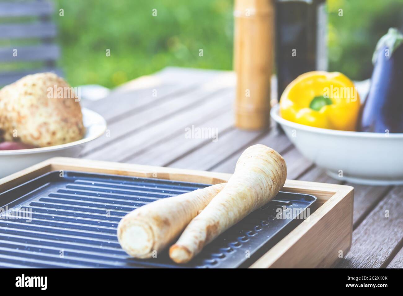 The barbecue evening: it can also be vegetarian, with delicious cucumber salad and grilled vegetables. Stock Photo