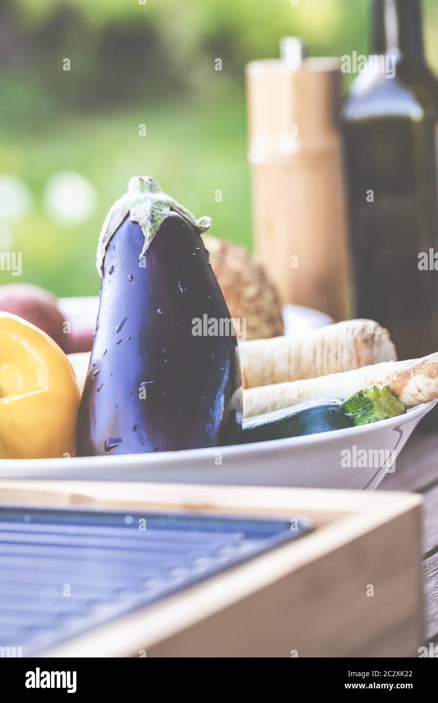 The barbecue evening: it can also be vegetarian, with delicious cucumber salad and grilled vegetables. Stock Photo