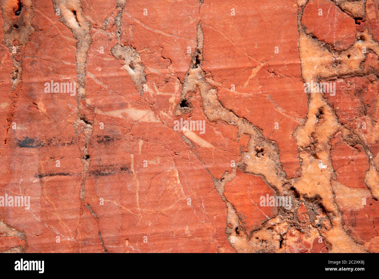 Red marble wall in an abandoned quarry in the eastern alps near Winzendorf in Austria. Stock Photo