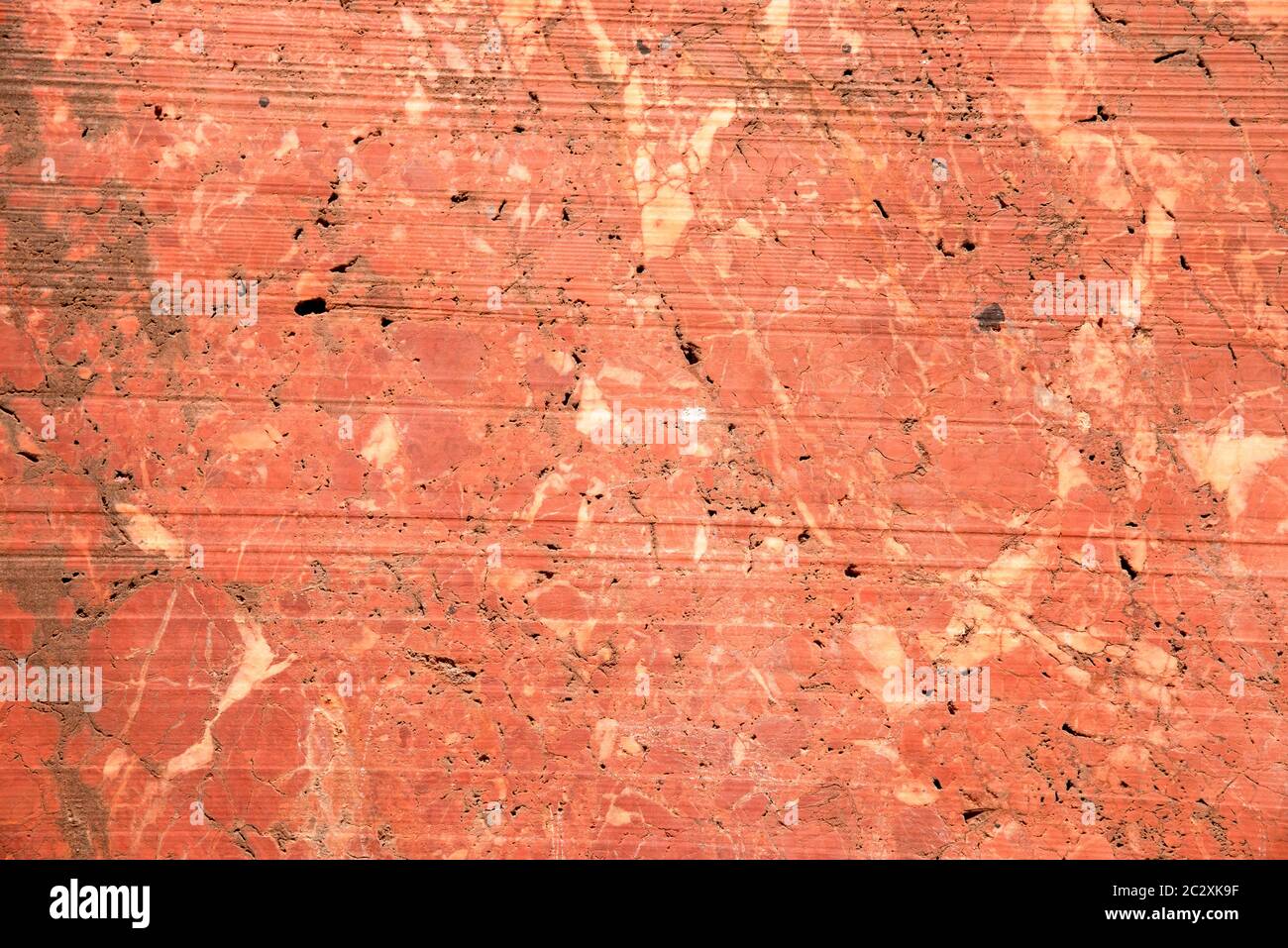 Red marble wall in an abandoned quarry in the eastern alps near Winzendorf in Austria. Stock Photo
