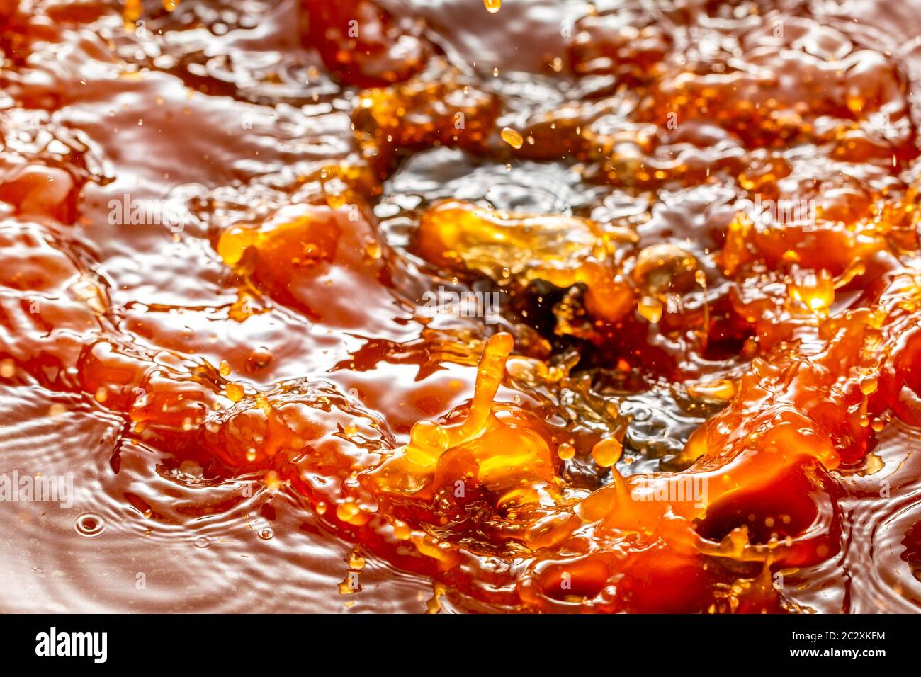 Rusty water drops splashing in dirty oily water, drops of stagnant