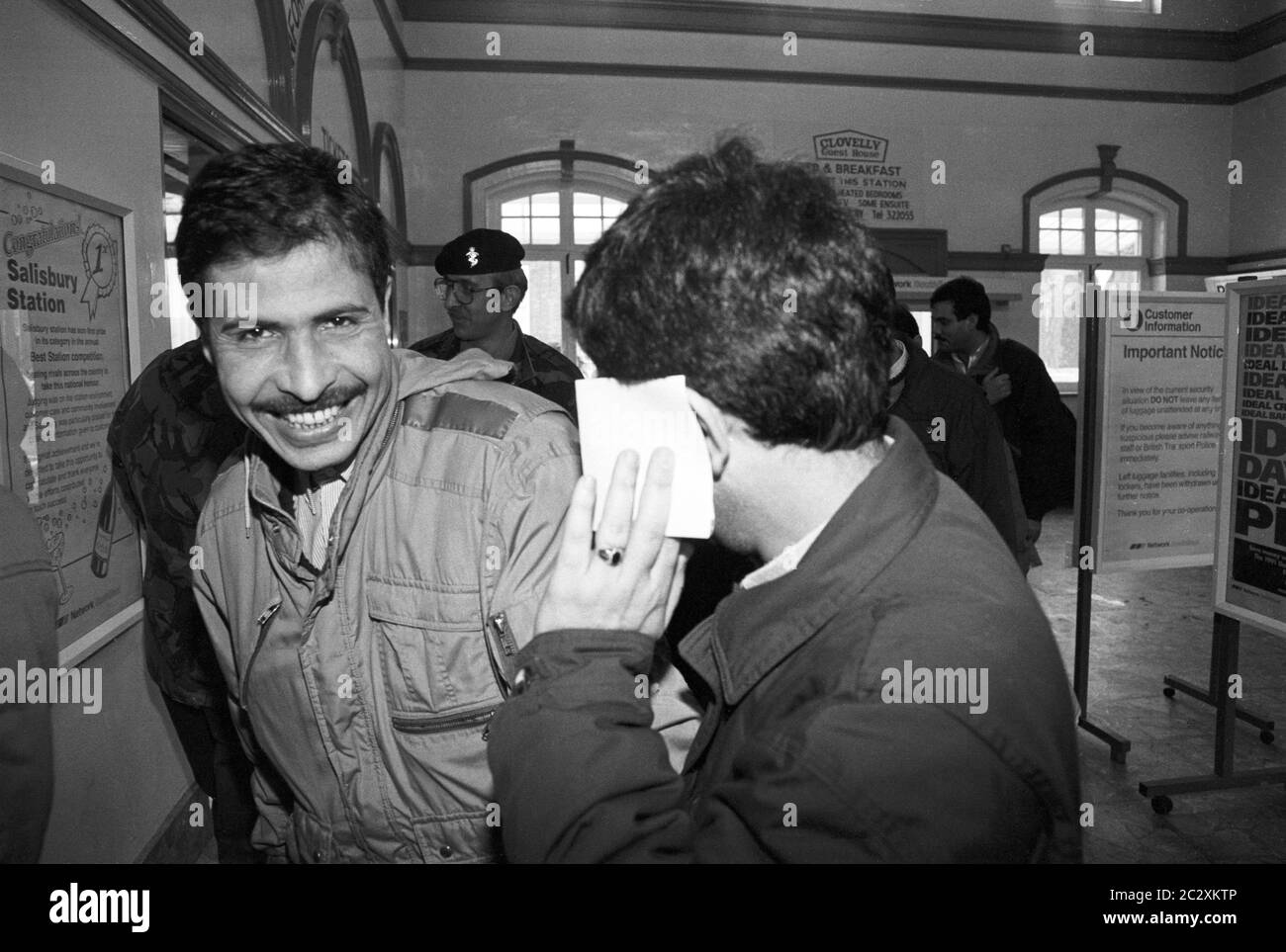 Released Iraqi POWs at Salisbury Train Station on the first leg of their trip home following release from Rollestone Camp on Salisbury Plain. UK. March 1991. Stock Photo