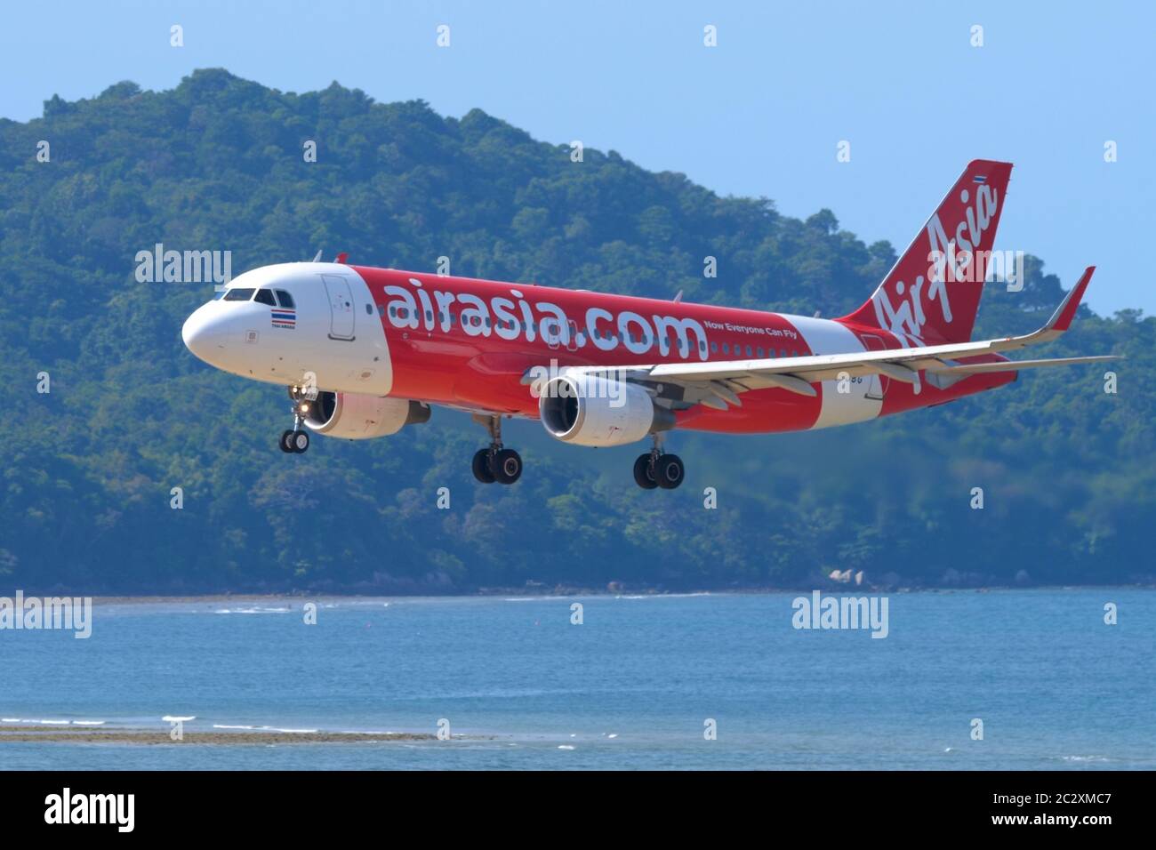 Thai AirAsia over ocean Stock Photo