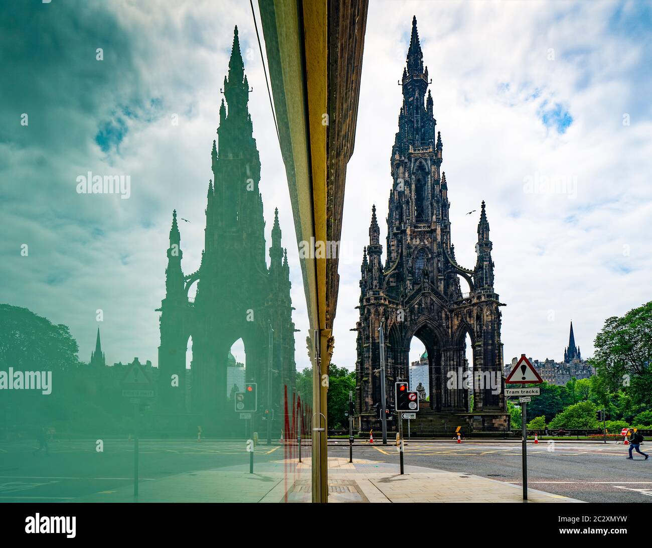 Scott Monument and an empty Princes Street reflected in shop window during covid-19 lockdown, Edinburgh, Scotland, UK Stock Photo