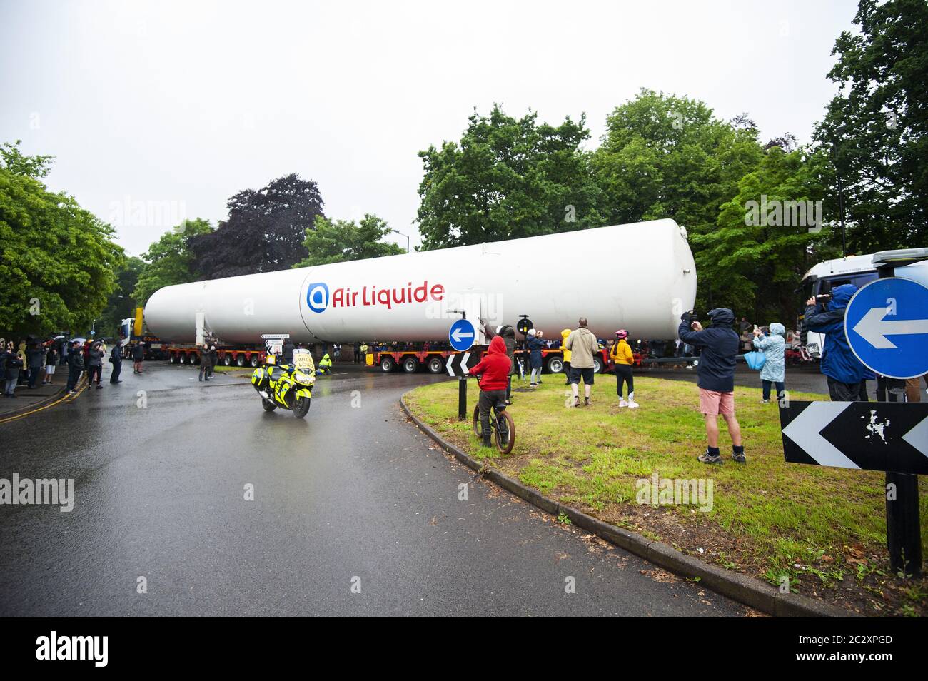 An empty colossal-sized ‘Air Liquide’ medical grade oxygen tank being transported on a 164ft (50m) lorry across Four Oaks, Sutton Coldfield. Stock Photo