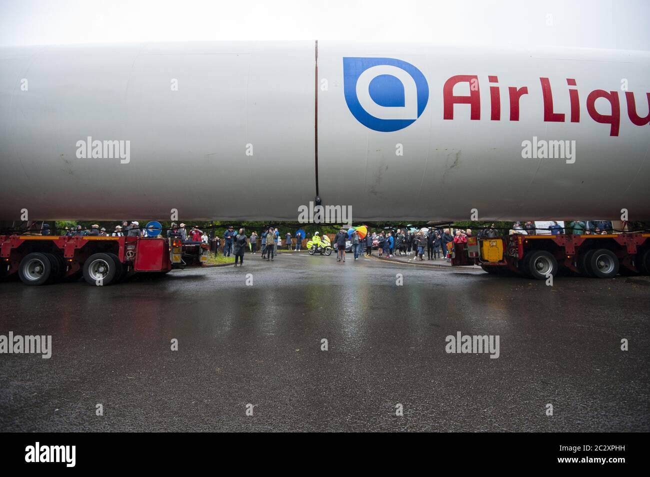 An empty colossal-sized ‘Air Liquide’ medical grade oxygen tank being transported on a 164ft (50m) lorry across Four Oaks, Sutton Coldfield. Stock Photo