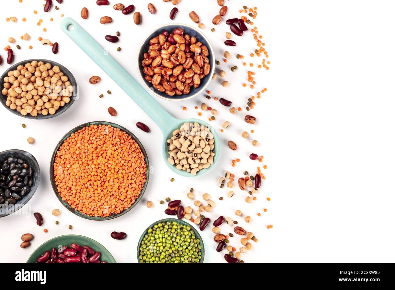Pulses. Legumes assortment on a white background, overhead shot with a