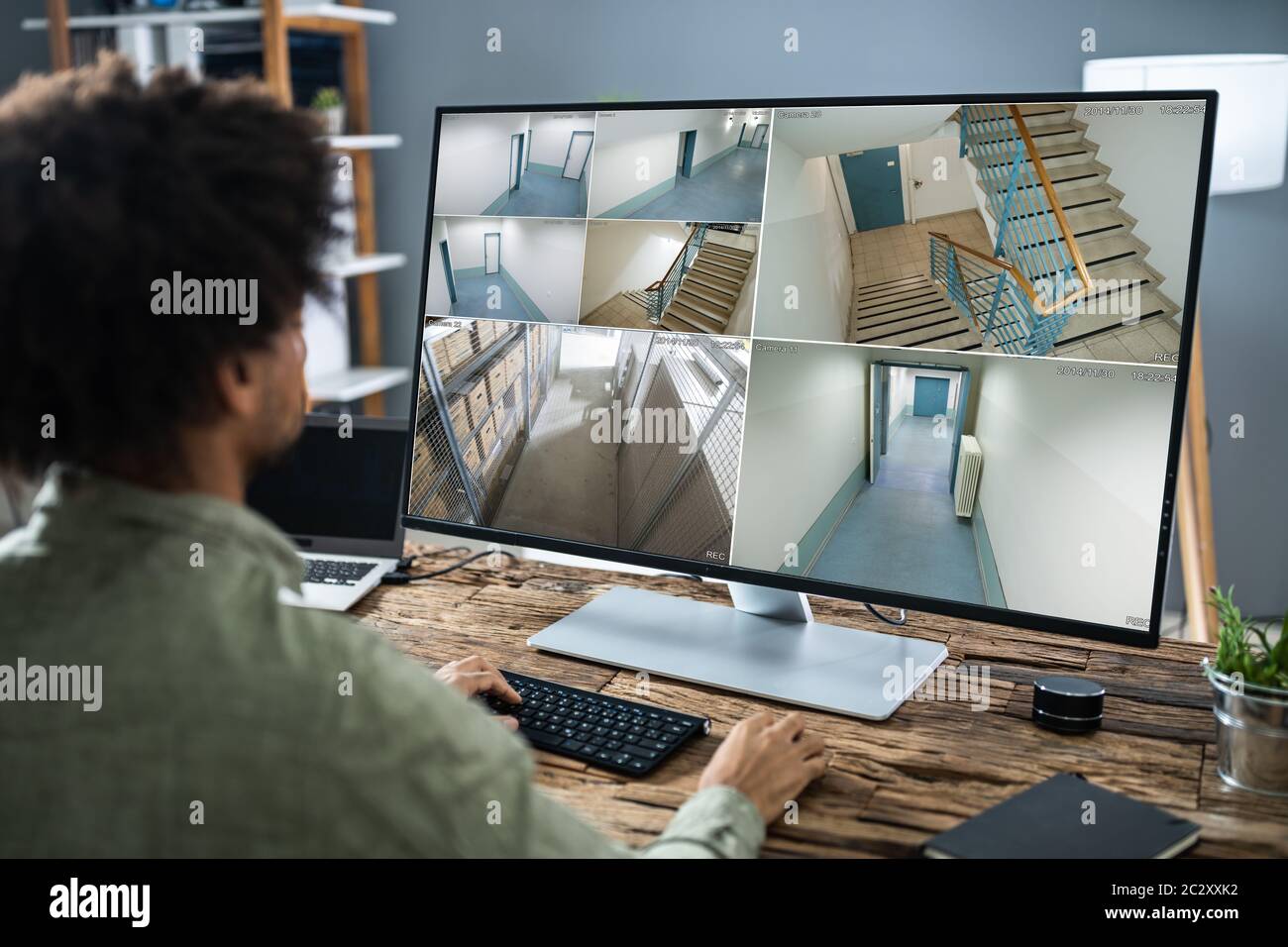 Security System Operator Looking At CCTV Footage Stock Photo Alamy