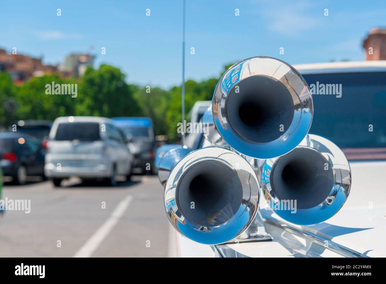 Steel chrome horn horn in retro style on the hood of a car Stock Photo