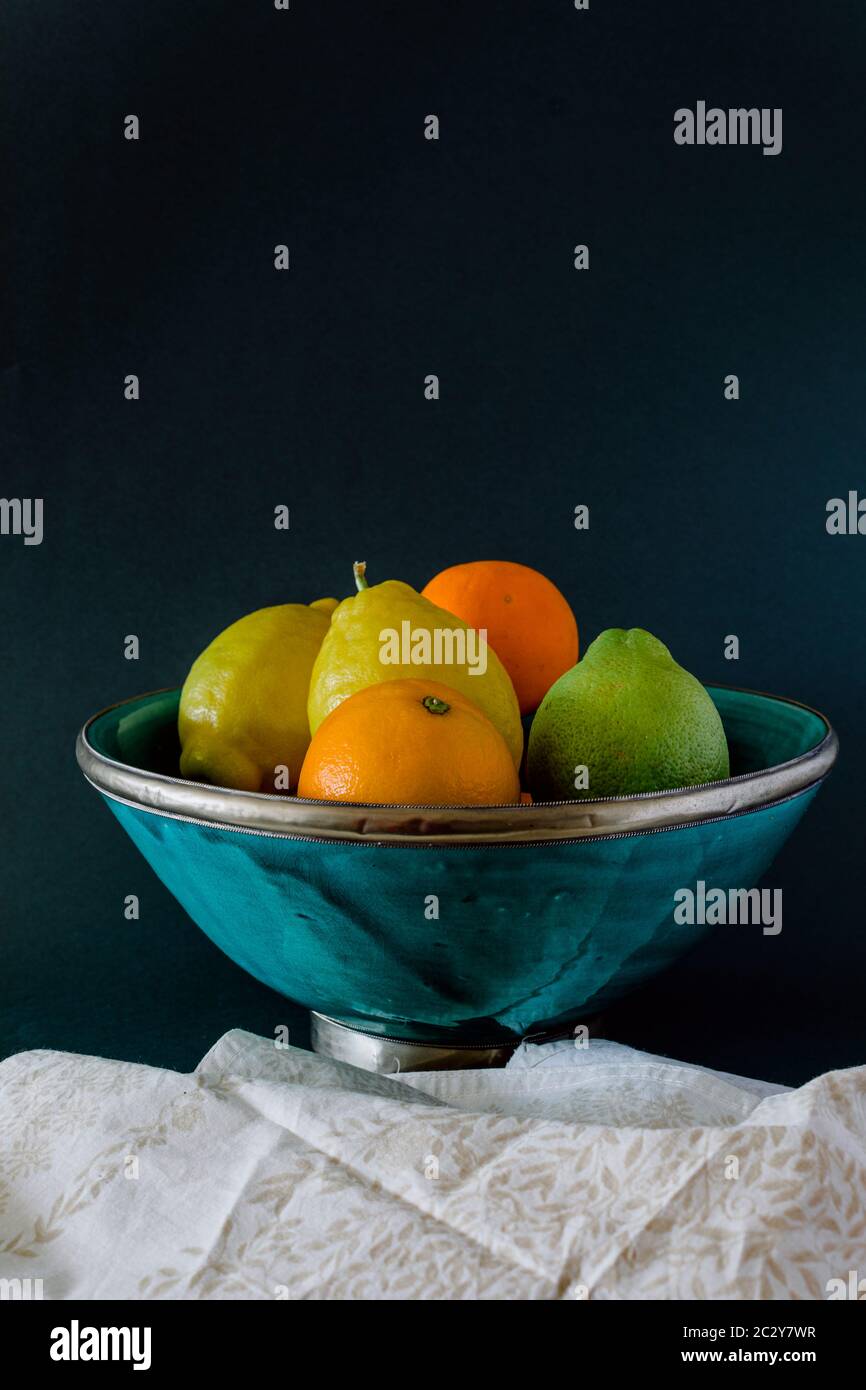 Turquoise bowl of refreshing citrus, orange, lemon and lime Stock Photo ...