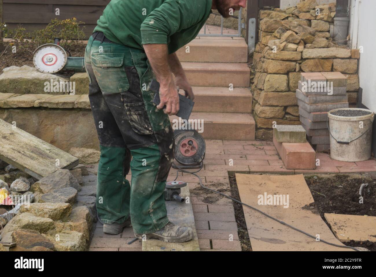 Reworking with technology Tile cutting with an angle grinder Stock Photo