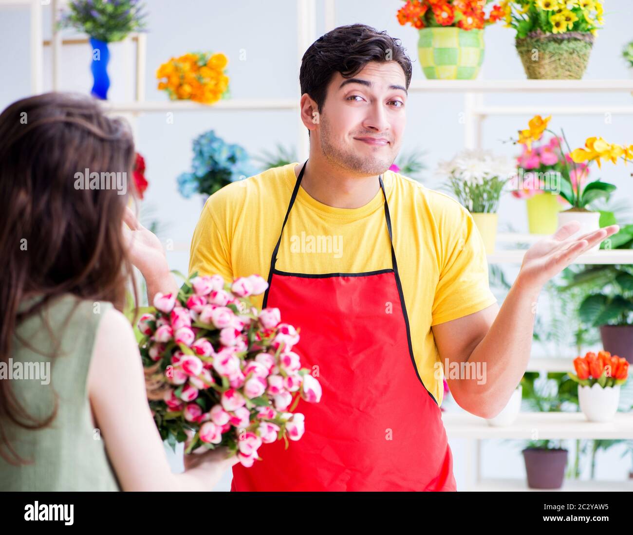Florist selling flowers in a flower shop Stock Photo Alamy