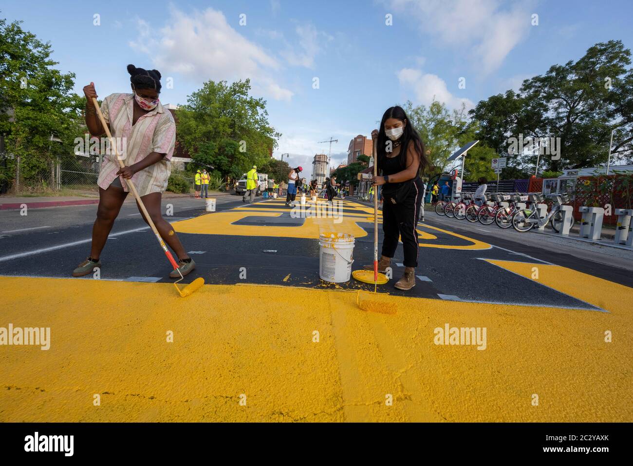Street artists paint a mural on east 11th St near downtown Austin, TX, that says 'Black Artists Matters' two days after the same group painted 'Black Austin Matters' in large yellow letters on Congress Avenue in the heart of downtown. Stock Photo