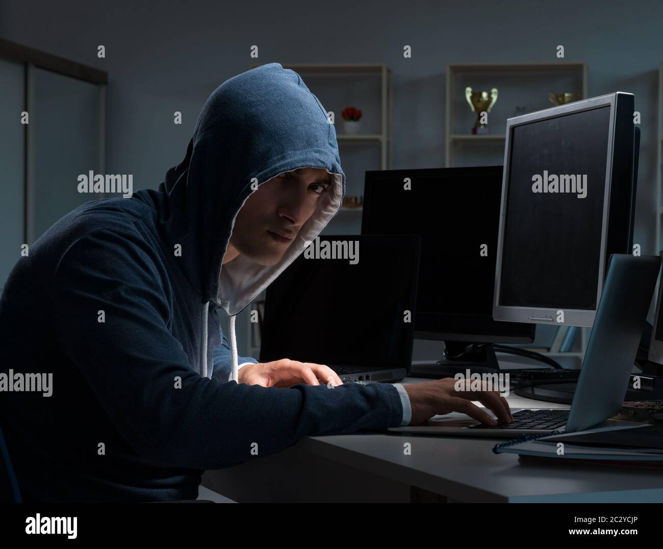 Hacker hacking computer at night Stock Photo - Alamy