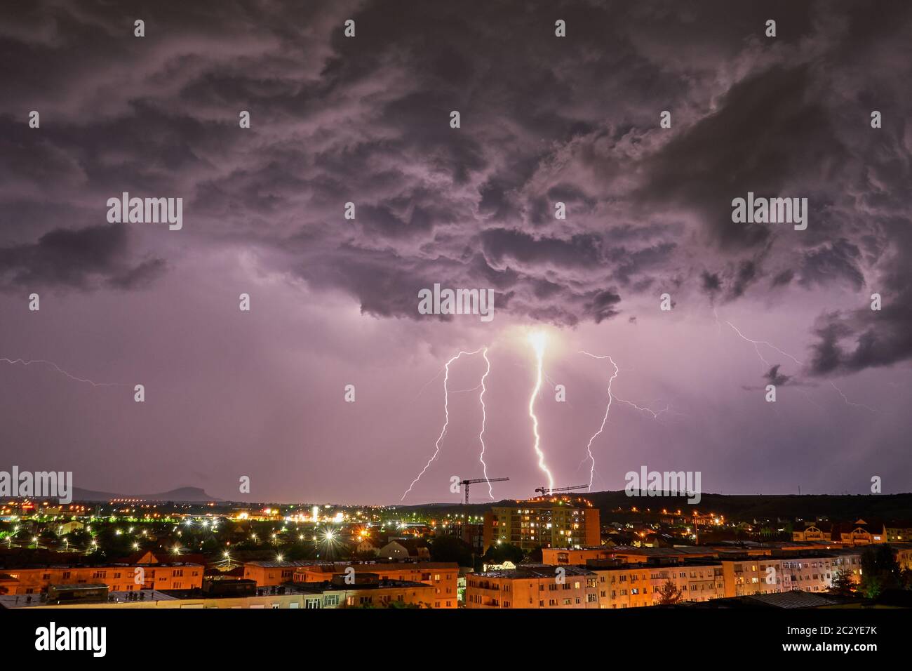 Storm Clouds and Lightning Bolts Above The City Stock Photo - Alamy