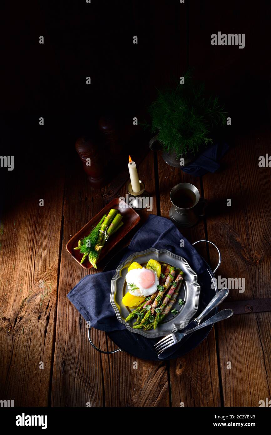 delicious green asparagus wrapped in bacon and egg Stock Photo